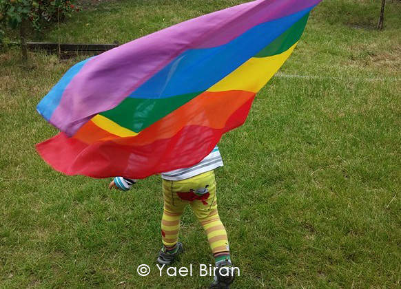 Ben with flag - NERD Blog - #PRIDE: To Come Out or Not To Come Out?