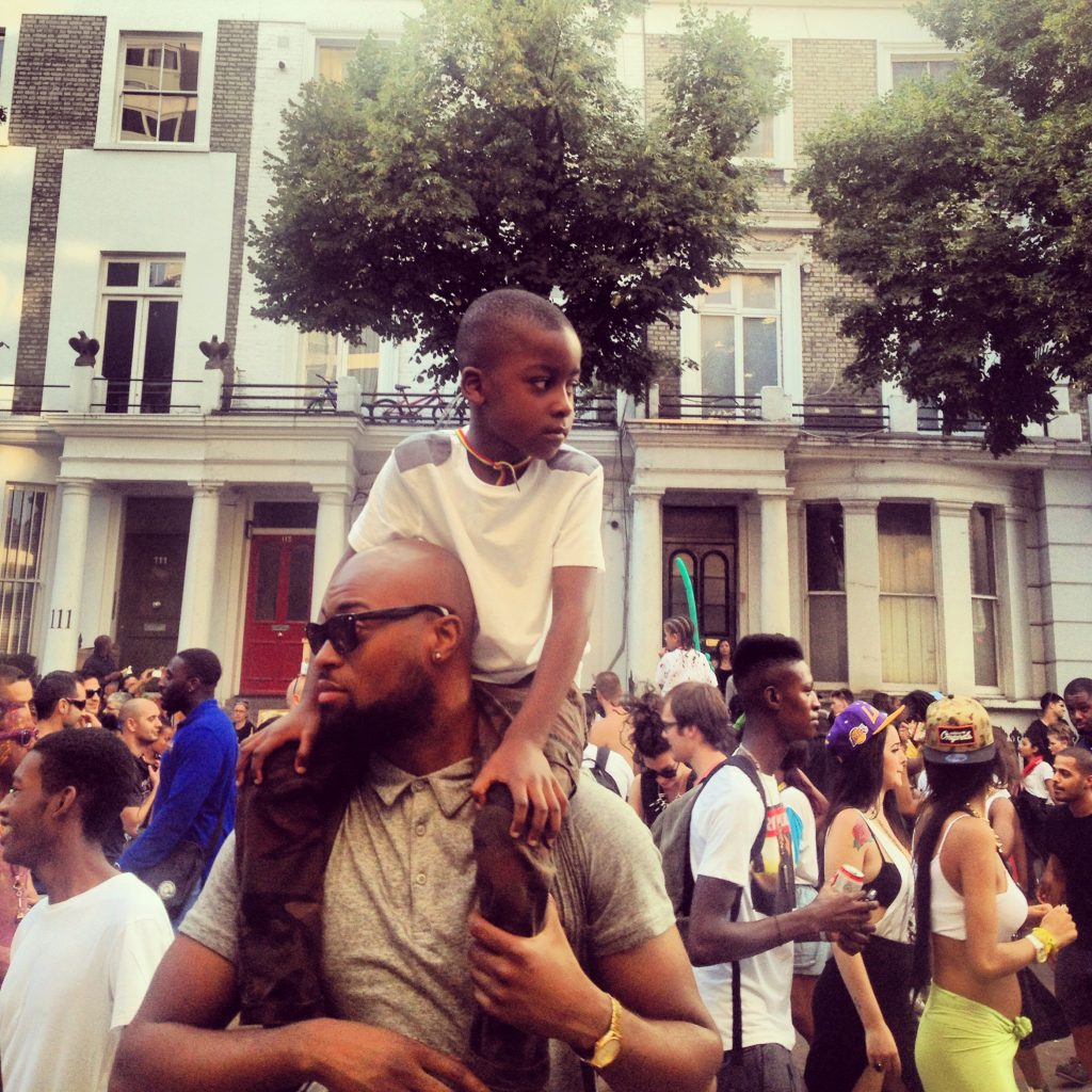 Anthony Dziworshie with his son on his shoulders in support of his thoughts on equal representation in this article. 